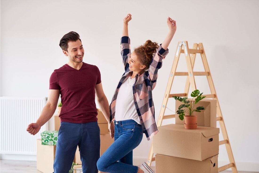 A lady and a man are happy they are moving.